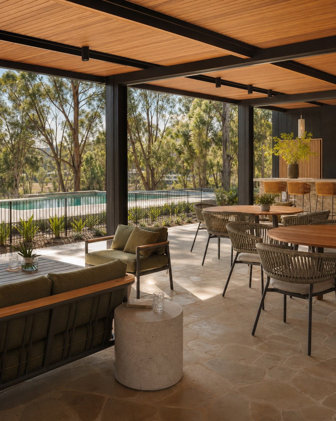 Indoor-outdoor land-lease community pavilion with lounge and dining furniture